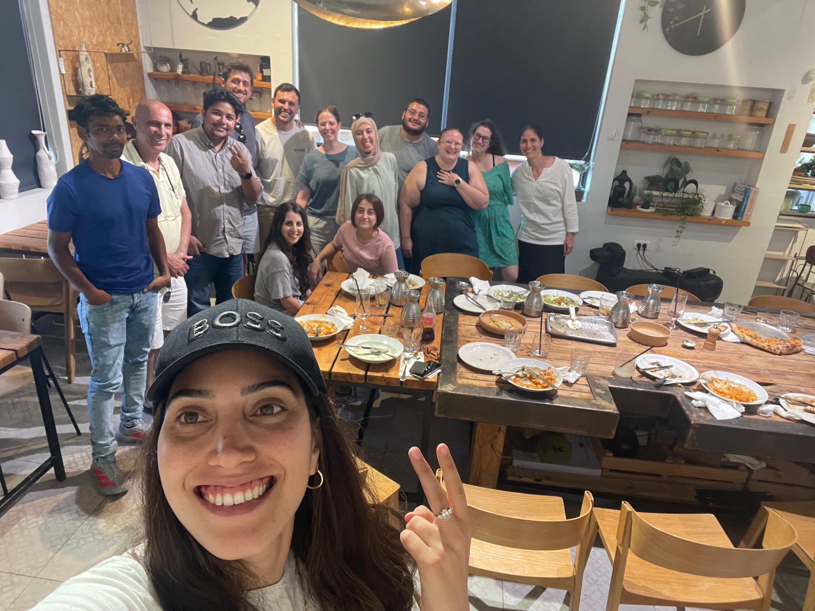 Group selfie of the lab at the dinner table